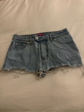Edikted Light Blue Denim micro Skirt with Frayed Hem